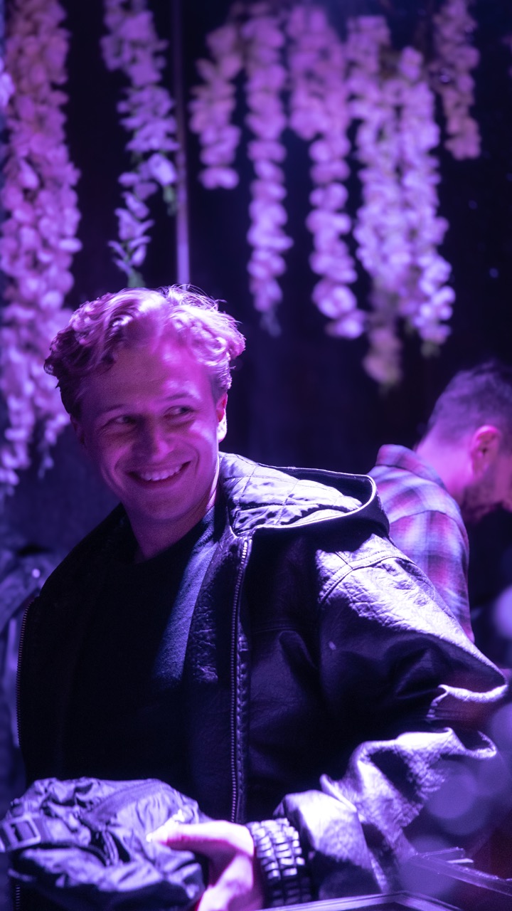 Tommy Phillips smiling backstage at Delasole 2025