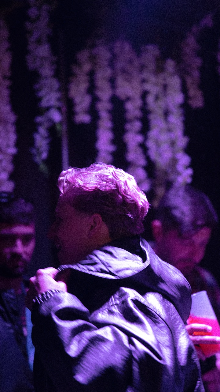 Side profile of Tommy Phillips in the crowd