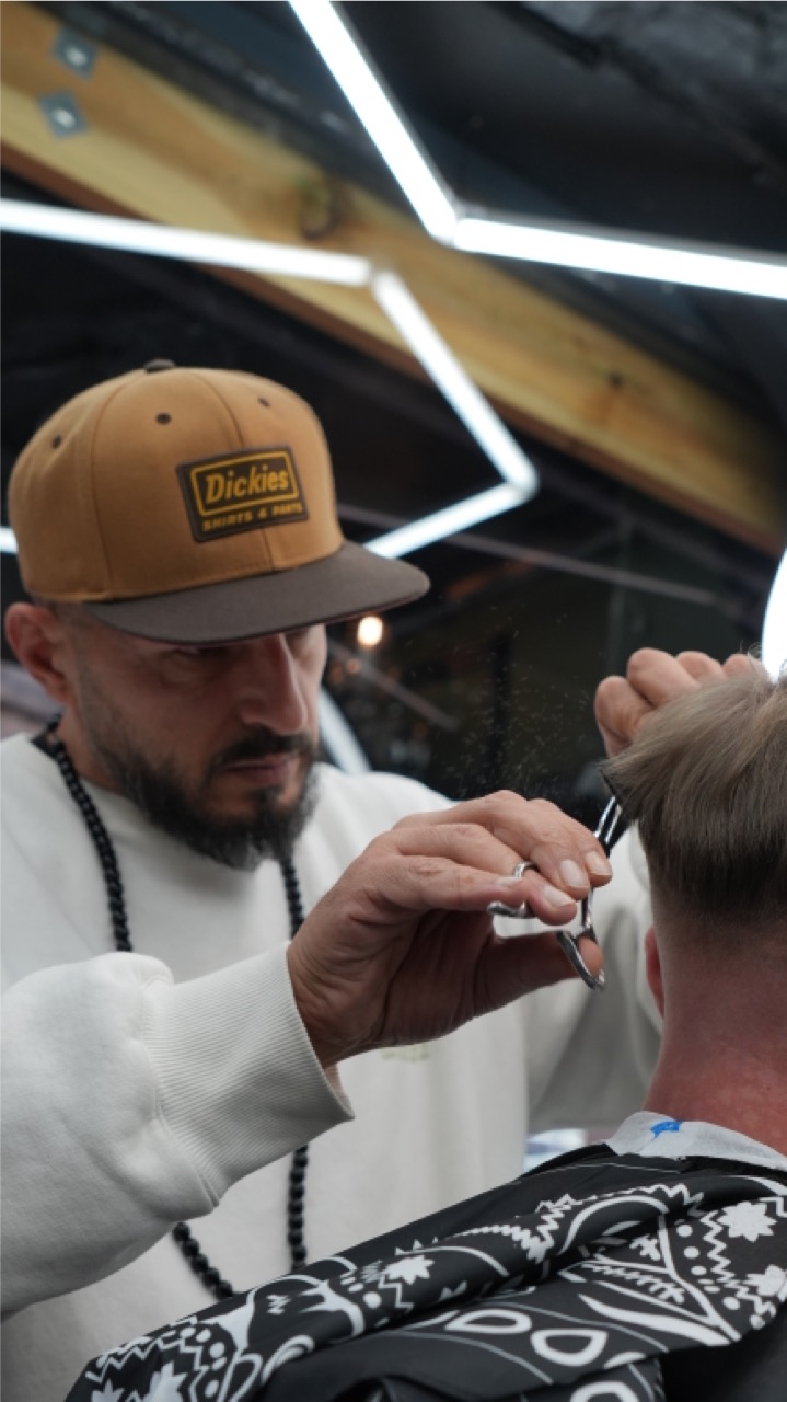 Scissor-over-comb cut in progress at Tip Top Worthing