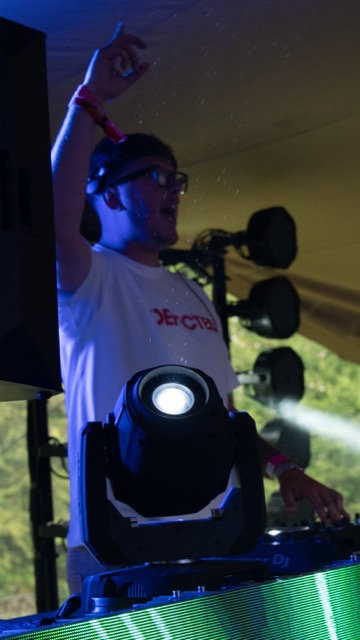 Dupex with hands raised behind the decks