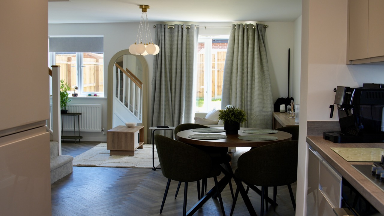 Open-plan kitchen and dining area of a Corby Airbnb