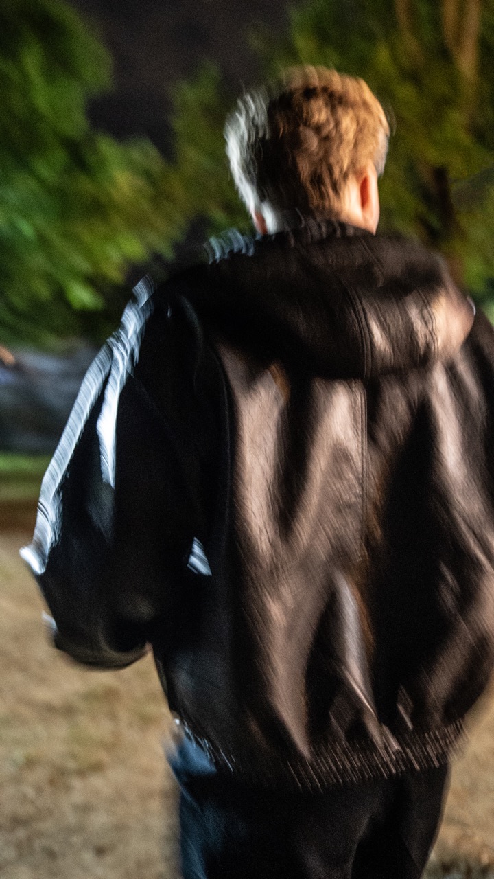 Motion-blur shot of Tommy Phillips walking through the site