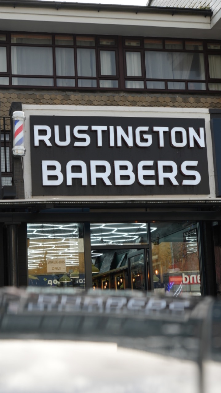 Rustington Barbers shopfront signage and barber pole